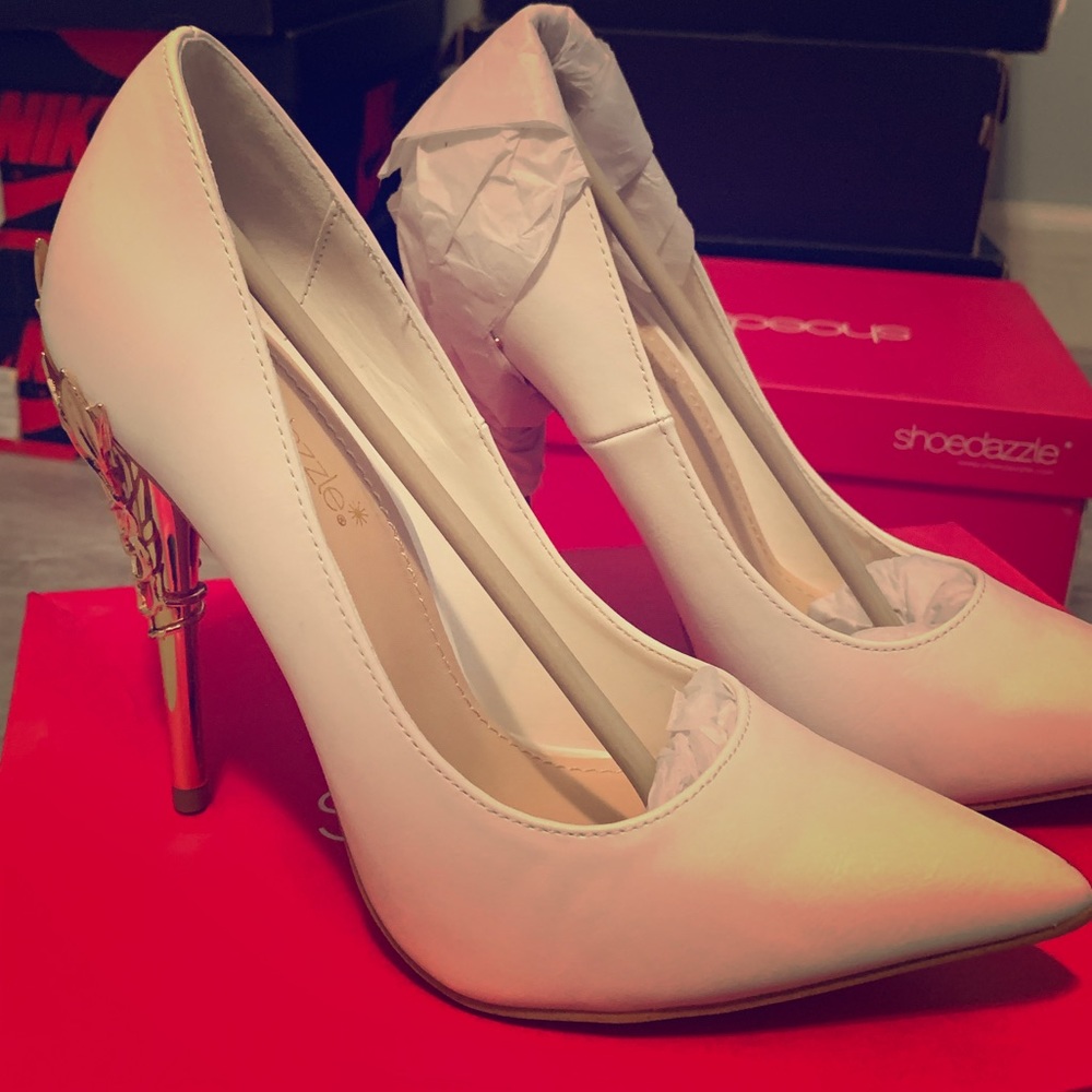 White pumps with metallic gold heel